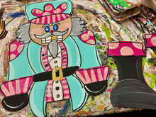 Load image into Gallery viewer, Nutcracker door hanger with ribbon legs, pink and teal.
