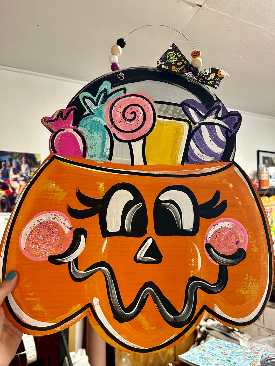 Jack o lantern with candy, door hanger, 18”