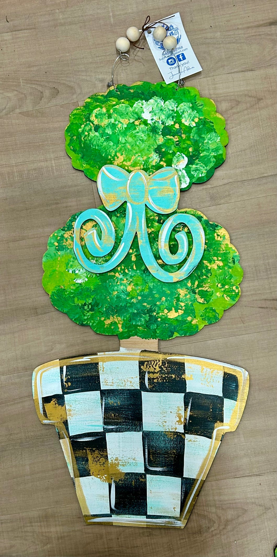 Checkered pot topiary with teal bow and gold accents, door hanger