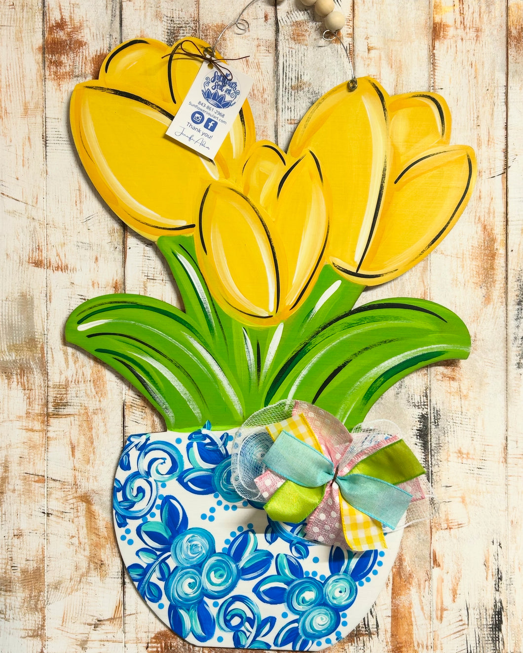 Yellow tulips in blue and white pot door hanger